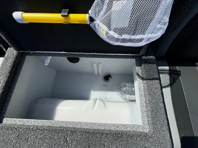 Slide: The Image of Open storage compartment in 2022 Lund 1675 Adventure SS boat with net and bottle. - 28