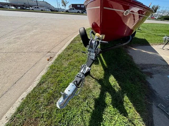 Slide: The Image of 2022 Lund 1675 Adventure SS boat on trailer, parked on grass. - 3