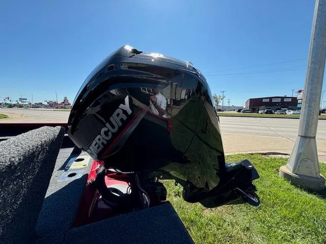 Slide: The Image of 2022 Lund 1675 Adventure SS with Mercury outboard motor on display outdoors. - 5