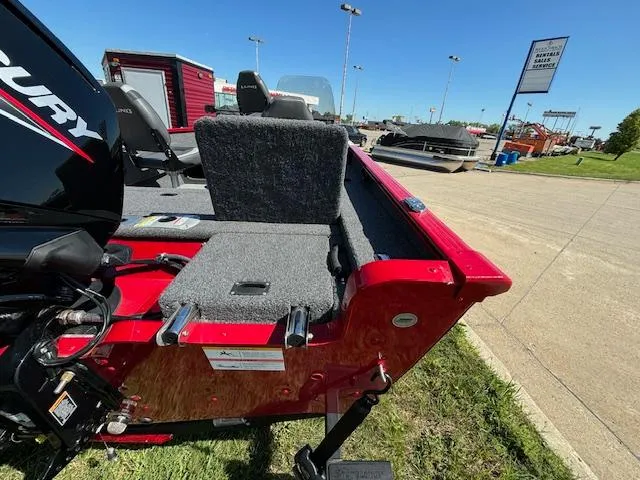 Slide: The Image of 2022 Lund 1675 Adventure SS boat, red exterior, parked outdoors with Mercury engine. - 7