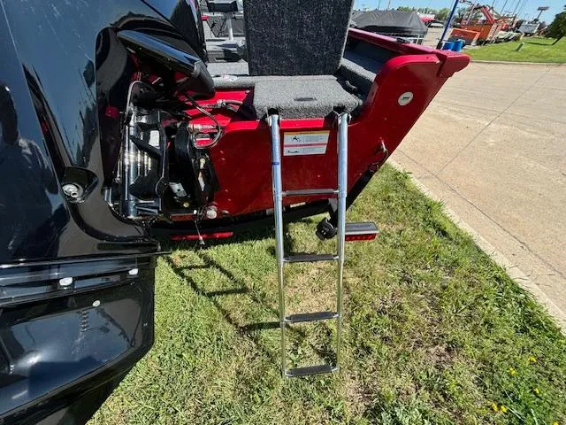 Slide: The Image of 2022 Lund 1675 Adventure SS boat with ladder on grassy area. - 8