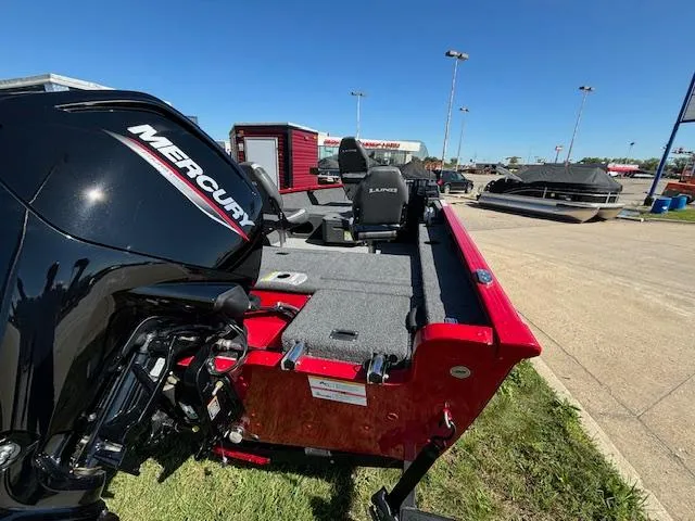 Slide: The Image of 2022 Lund 1675 Adventure SS boat with Mercury engine, parked outdoors. - 9