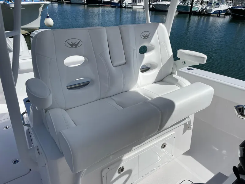 Slide: The Image of Luxury seating on 2023 Southport 33 FE boat, docked at marina. - 11