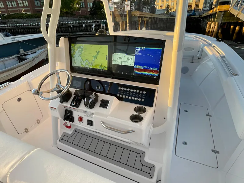 Slide: The Image of 2023 Southport 33 FE boat dashboard with advanced navigation and control systems. - 12