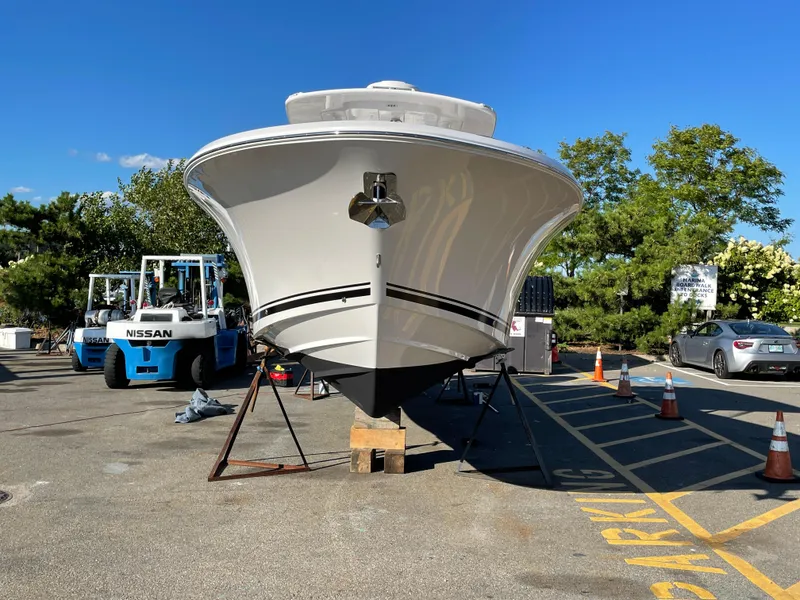 Slide: The Image of 2023 Southport 33 FE boat on stands in a parking lot. - 2