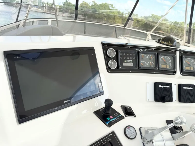 Slide: The Image of Control panel of a 2000 Sea Ray 560 Sedan Bridge yacht with navigation equipment. - 14