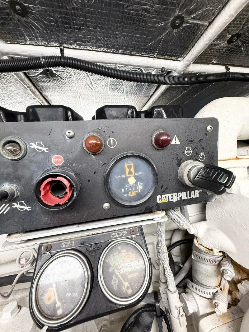 Slide: The Image of Control panel of a 2000 Sea Ray 560 Sedan Bridge with Caterpillar engine gauges. - 38