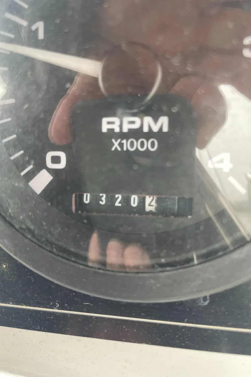 Slide: The Image of Close-up of Catalina 309 tachometer showing 3,204 RPM, model year 2008. - 15