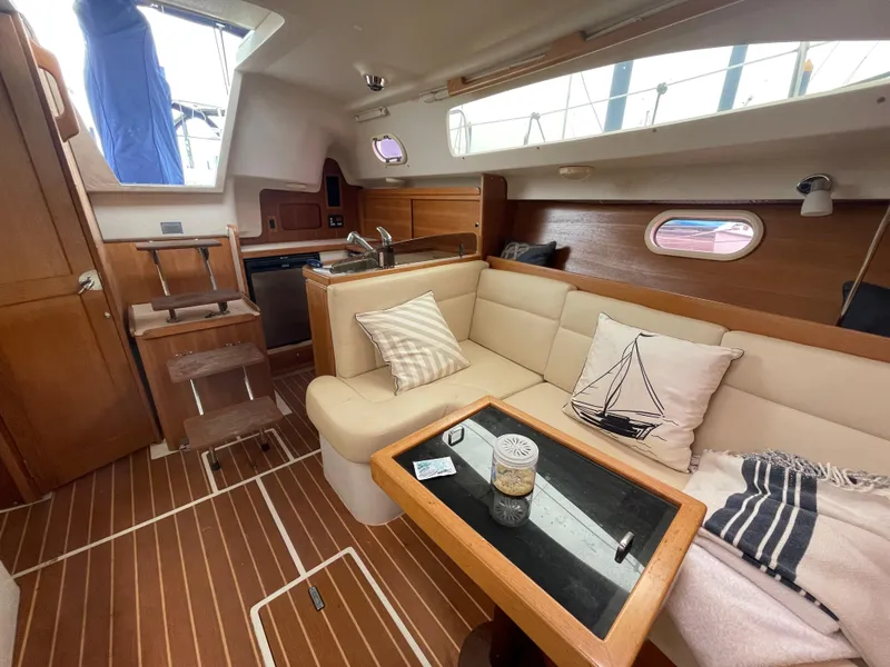 Slide: The Image of Interior of 2008 Catalina 309 sailboat with cozy seating and nautical decor. - 20