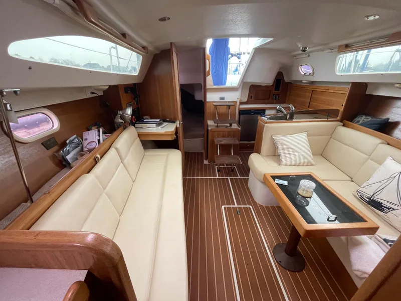 Slide: The Image of Interior of 2008 Catalina 309 sailboat with cozy seating and wooden finishes. - 28
