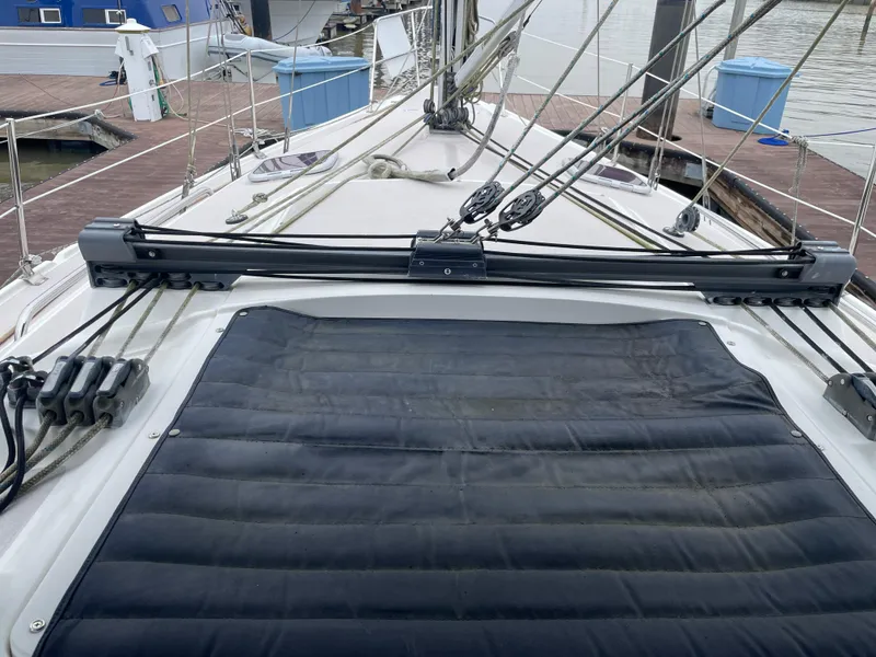 Slide: The Image of 2008 Catalina 309 sailboat deck with rigging and dock in background. - 29