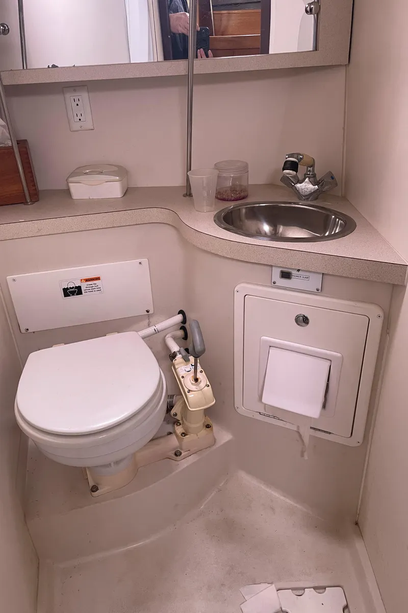 Slide: The Image of Compact bathroom in 2008 Catalina 309 sailboat with toilet and sink. - 30