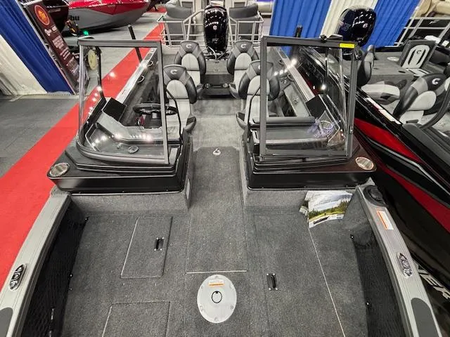 Slide: The Image of 2025 Crestliner 1850 Fish Hawk WT JS boat interior with seating and storage compartments. - 16