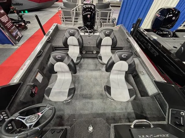 Slide: The Image of 2025 Crestliner 1850 Fish Hawk WT JS boat interior with four seats and steering wheel. - 17