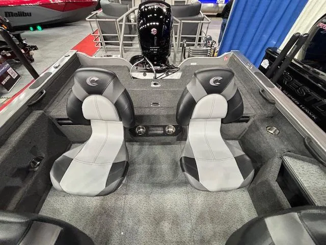 Slide: The Image of 2025 Crestliner 1850 Fish Hawk WT JS interior with dual seats and motor. - 18