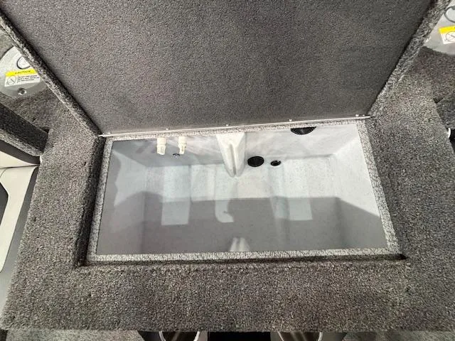 Slide: The Image of Open storage compartment in 2025 Crestliner 1850 Fish Hawk WT JS boat. - 21