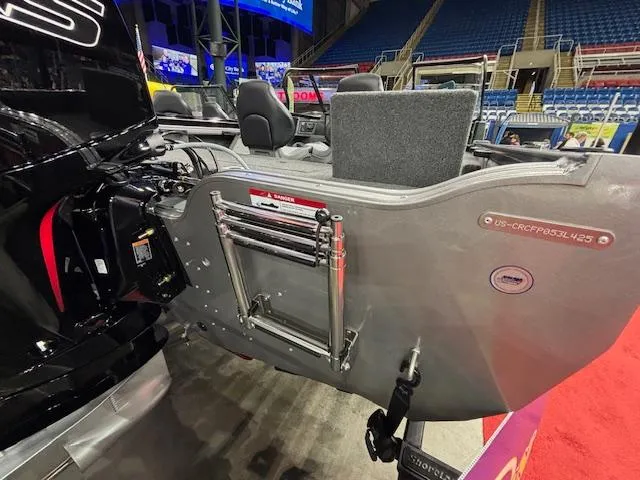 Slide: The Image of 2025 Crestliner 1850 Fish Hawk WT JS boat interior with seating and motor details. - 4