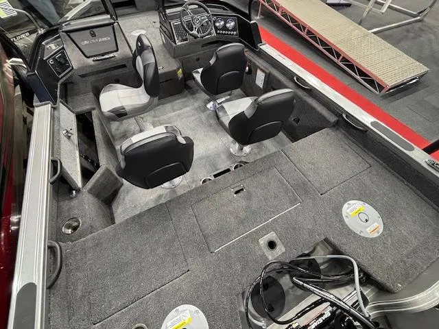 Slide: The Image of 2025 Crestliner 1850 Fish Hawk WT JS interior with seating and control console. - 5
