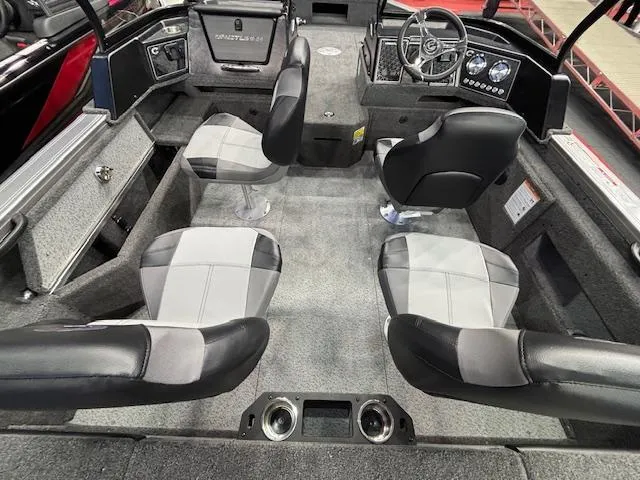 Slide: The Image of 2025 Crestliner 1850 Fish Hawk WT JS interior with four seats and modern dashboard. - 6