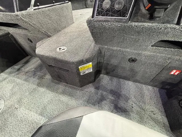 Slide: The Image of Interior of 2025 Crestliner 1850 Fish Hawk WT JS boat, featuring carpeted flooring and seating. - 9