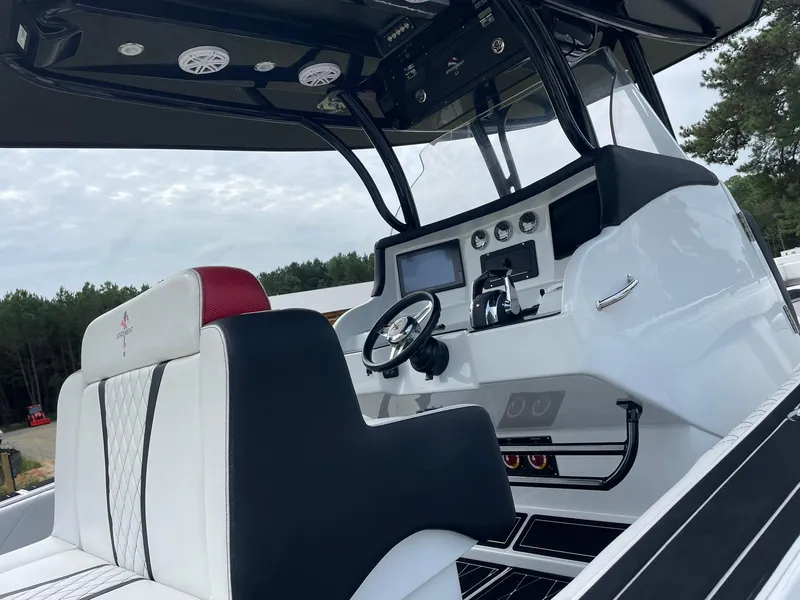 Slide: The Image of Interior view of 2018 Statement 35 CC boat, featuring modern helm and seating. - 3