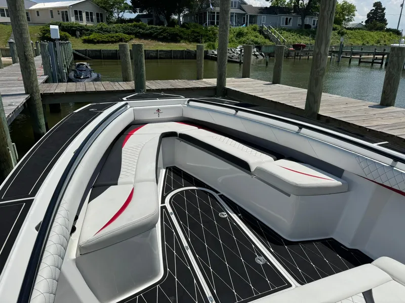 Slide: The Image of Luxurious 2018 Statement 35 CC boat with sleek seating at a dock. - 6