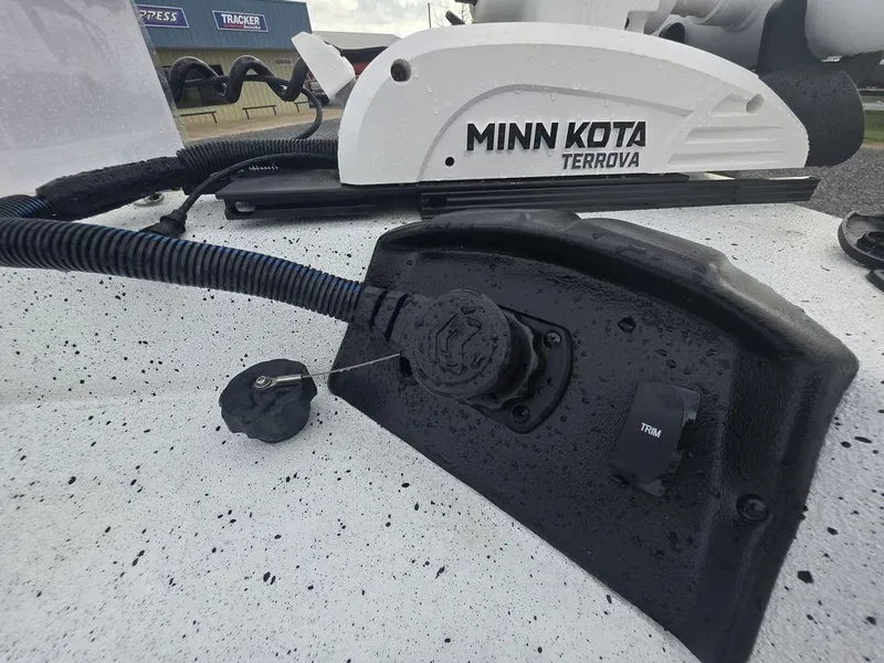 Slide: The Image of 2025 Xpress H22B boat with Minn Kota Terrova trolling motor, close-up view. - 16