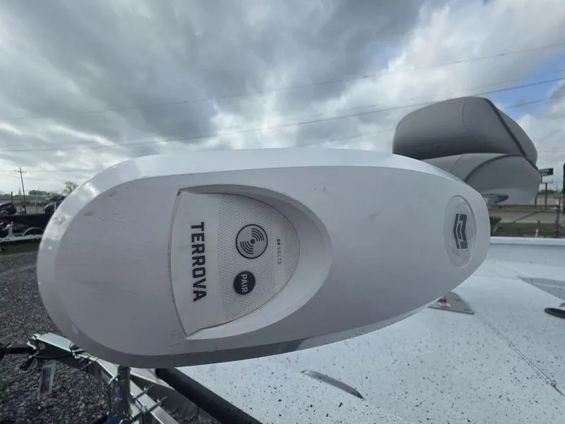 Slide: The Image of Minn Kota Terrova motor on 2025 Xpress H22B boat under cloudy sky. - 17