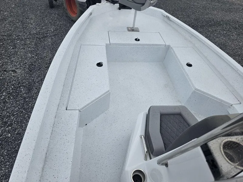 Slide: The Image of 2025 Xpress H22B boat interior with seating and storage compartments. - 23