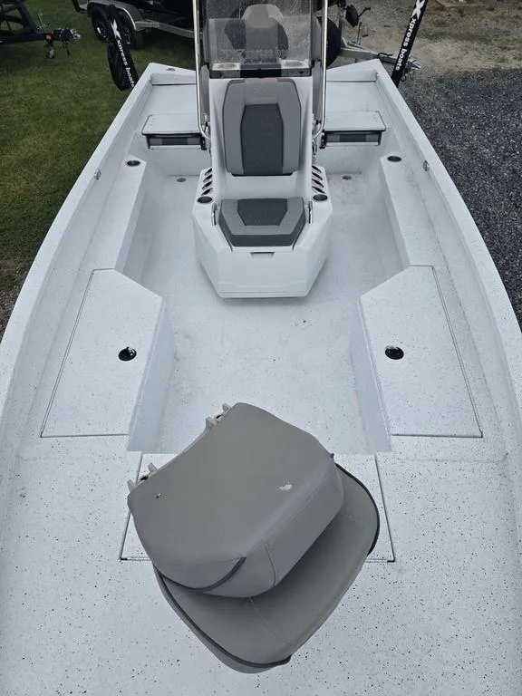 Slide: The Image of 2025 Xpress H22B boat interior with seating and storage compartments. - 25