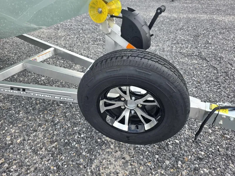 Slide: The Image of Trailer wheel of 2025 Xpress H22B on gravel surface. - 29