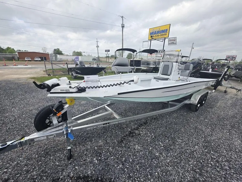 Slide: The Image of 2025 Xpress H22B boat on trailer at dealership, overcast sky. - 4