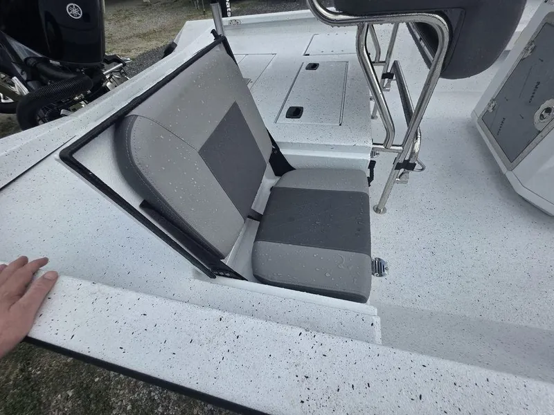 Slide: The Image of 2025 Xpress H22B boat with foldable seat and sleek interior design. - 9
