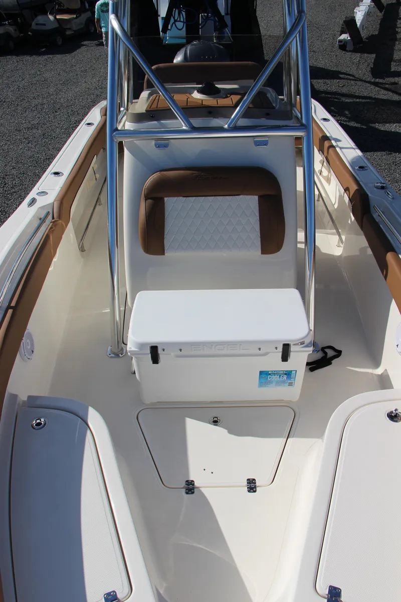 Slide: The Image of 2025 Pioneer 222 Sportfish boat interior with seating and storage compartments. - 8