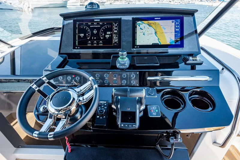 Slide: The Image of Cockpit of 2023 Pardo Yachts P38 with navigation screens and steering wheel. - 16