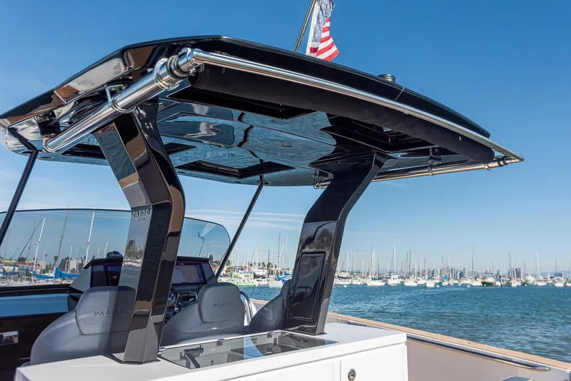 Slide: The Image of 2023 Pardo Yachts P38 with sleek design, docked in a marina under clear blue skies. - 18