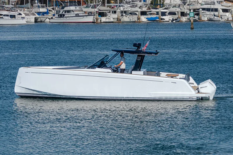 Slide: The Image of 2023 Pardo Yachts P38 cruising in a marina, showcasing sleek design and luxury features. - 21