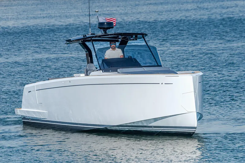 Slide: The Image of 2023 Pardo Yachts P38 cruising on calm waters with an American flag. - 31