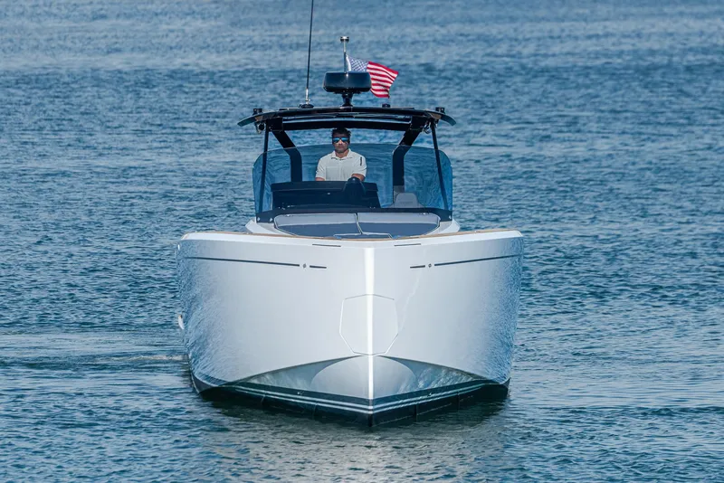 Slide: The Image of 2023 Pardo Yachts P38 cruising on water, front view with American flag. - 33