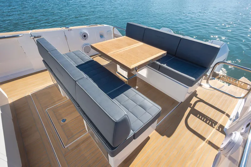 Slide: The Image of 2023 Pardo Yachts P38 interior with elegant seating and wooden table on deck. - 4
