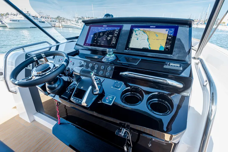 Slide: The Image of 2023 Pardo Yachts P38 helm with advanced navigation displays and controls. - 15