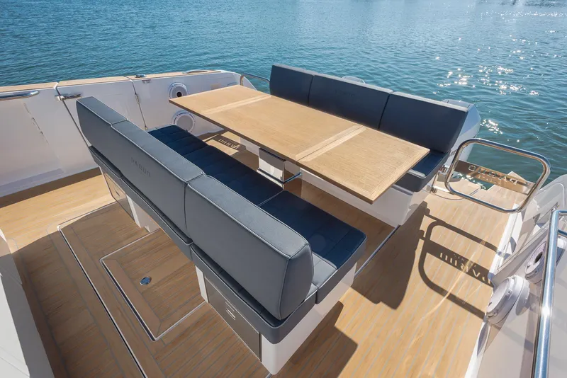 Slide: The Image of 2023 Pardo Yachts P38 deck with seating and table, overlooking the water. - 5
