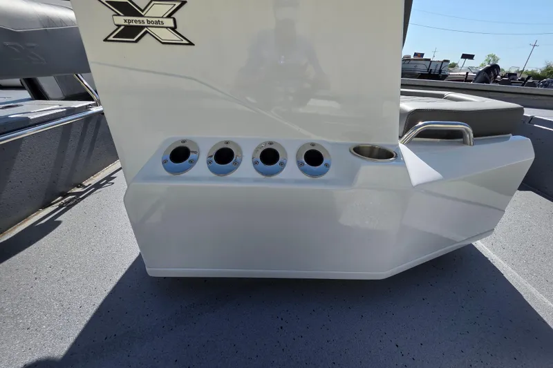 Slide: The Image of 2025 Xpress H20B Bay boat console with rod holders and seating. - 8