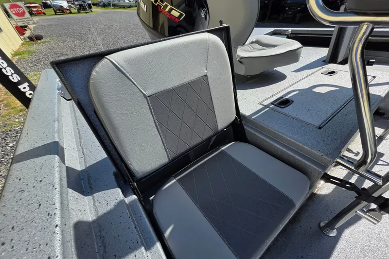 Slide: The Image of 2025 Xpress H20B Bay boat seat with gray upholstery and diamond pattern design. - 9