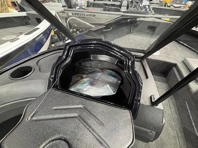 Slide: The Image of 2025 Crestliner 1850 Super Hawk WT JS boat interior with storage compartment. - 12