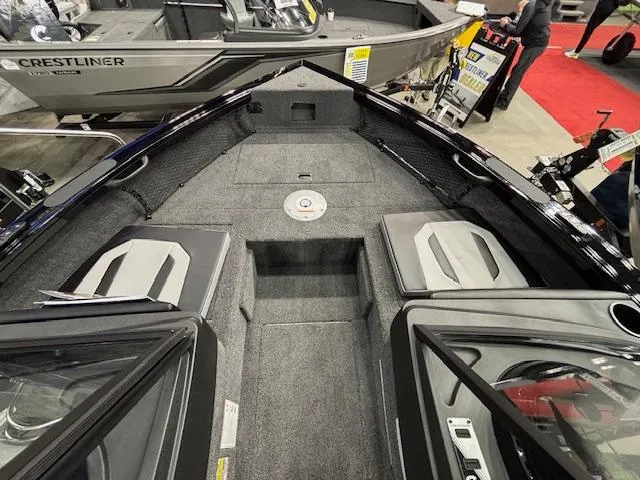 Slide: The Image of 2025 Crestliner 1850 Super Hawk WT JS boat interior with seating and storage. - 13