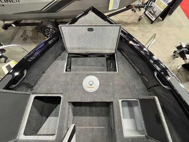 Slide: The Image of 2025 Crestliner 1850 Super Hawk WT JS boat interior with storage compartments. - 17