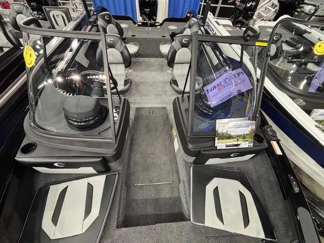 Slide: The Image of 2025 Crestliner 1850 Super Hawk WT JS interior with seating and console view. - 18