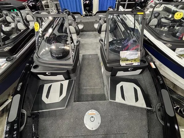 Slide: The Image of 2025 Crestliner 1850 Super Hawk WT JS interior with dual consoles and seating. - 19