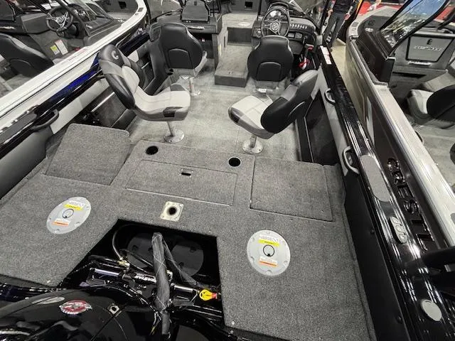 Slide: The Image of 2025 Crestliner 1850 Super Hawk WT JS interior with seating and storage compartments. - 2